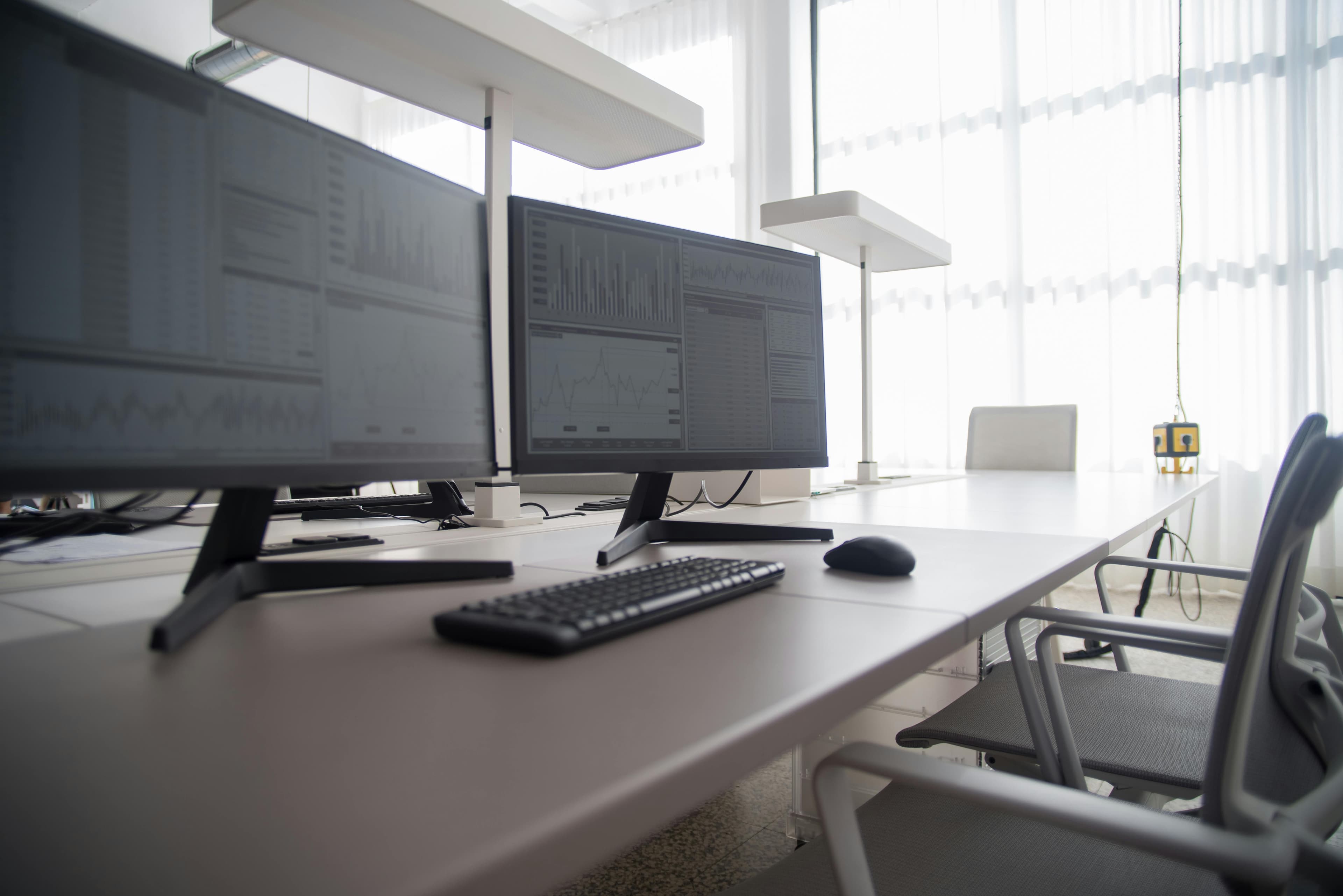Business environment — office workspace with dual monitors